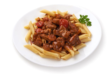Pasta with goulash with parsley leaf, isolated on white background. Close-up.