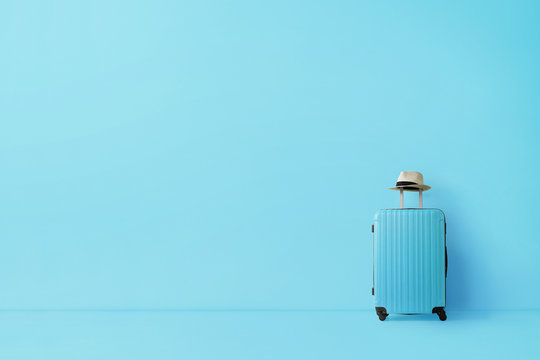 Ready to go, travel concept. Single suitcase in empty blue room with copy space