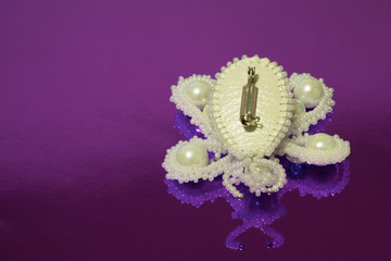 Brooch butterfly handmade from white beads, white artificial pearls and two zircons. The reverse...