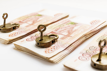 Money is protected. Cash in the Bank under lock and key. Padlock symbol of the safety of savings. Isolated.