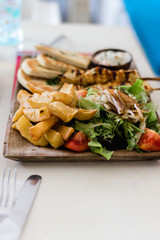 Greek gyros and souvlaki plate with pita bread and tzatziki
