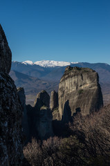 Landscape near Kalambaka town with Pindus mountains at background. Area near with monasteries and rock formations in Meteora, Greece.