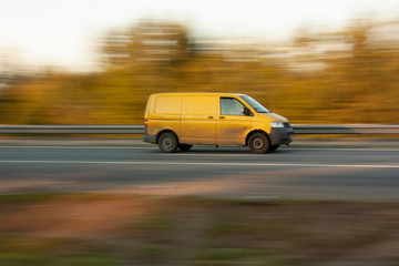 Fototapeta na wymiar Yellow car on the road