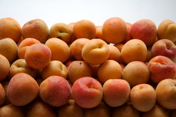 Heap of ripe apricots close up