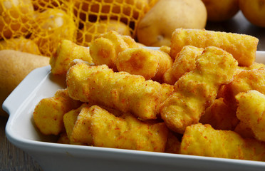 Frozen Cylindrical potato croquettes or German name is Kroketten.
 Food Product from Potatoes