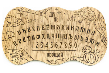 Ouija Board, yellow on a black background