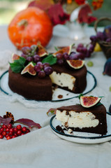 Autumn chocolate cheesecake decorated with figs and grapes