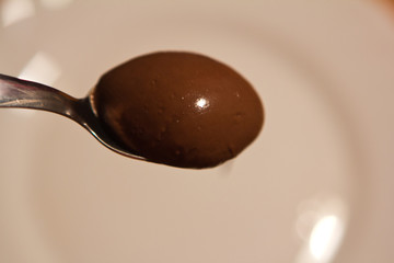 Chocolate paste wallpaper. Sweet sauce background.