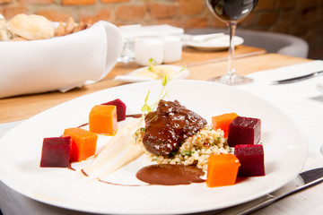 Beef cheeks with vegetables, roasted parsley root mousse , pearl barley, dark chocolate and demi glace sauce