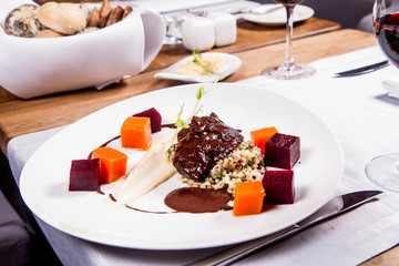 Beef cheeks with vegetables, roasted parsley root mousse , pearl barley, dark chocolate and demi glace sauce