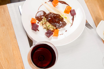 Beef cheeks with vegetables, roasted parsley root mousse , pearl barley, dark chocolate and demi glace sauce