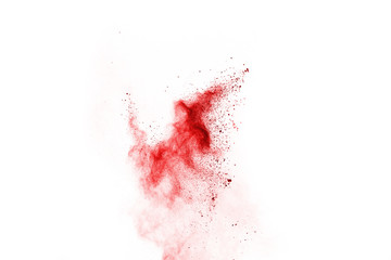 Freeze motion of red powder exploding, isolated on white background. Abstract design of red dust cloud. Particles explosion screen saver, wallpaper