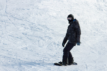 Fototapeta na wymiar Snowboarder on a background of snow