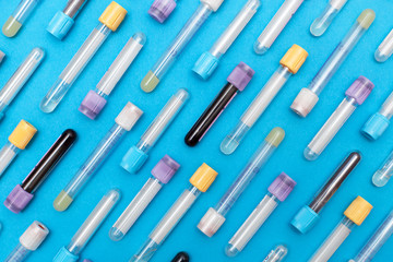 close-up medicine test tubes blood for blue background 3d illustration. Flat lay, top view, pattern. Hematology blood analysis report with colorful sample collection tubes.
