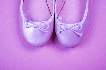 Kids shoes of gold colour.Moccasins for little princess