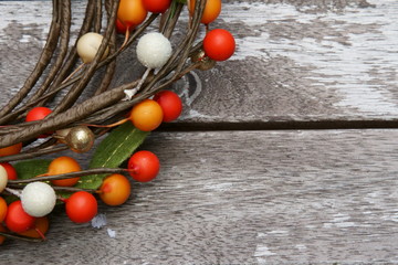 Colored berries on a wooden background
