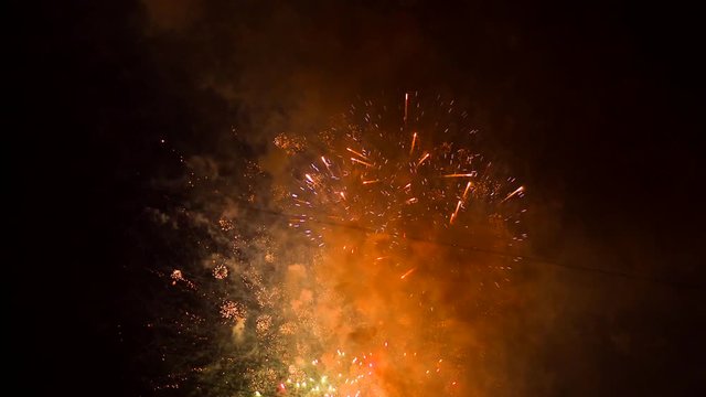 Sparkling stream of fireworks turn into balls