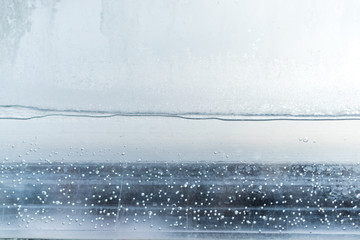 Fototapeta na wymiar Frozen drops on the window