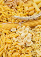 composition of raw pasta different shapes, frame of raw pasta. room for text 