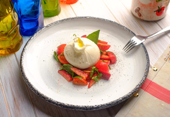 burrata cheese with strawberries in plate