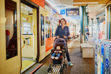 Woman with little girl at railway station