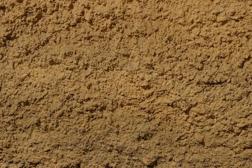 brown texture of dry plaster on the wall