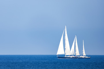 A beautiful and luxury sailboat is sailing during a Regatta in Sardinia. September 2018, Italy.