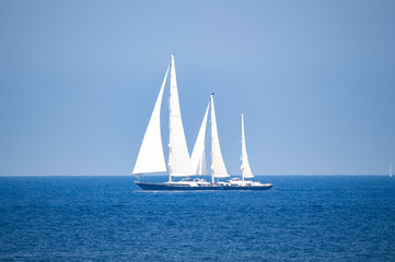 A beautiful and luxury sailboat is sailing during a Regatta in Sardinia. September 2018, Italy.