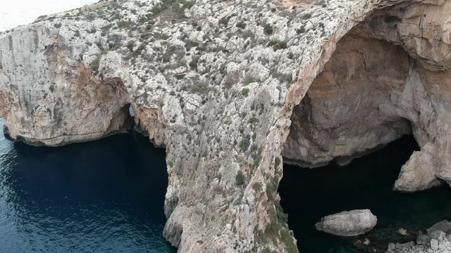 Revealing shot of the left side of Blue groto in Malta