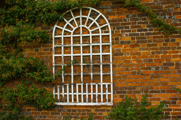 white window frame on a brick wall