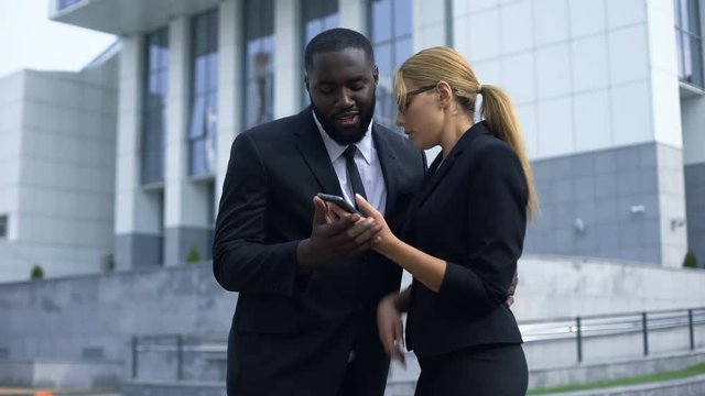 Businessman hitting on attractive co-worker, sexual harassment at workplace