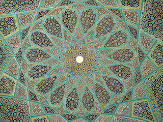 Detail of blue geometric patterns on the ceiling of a pavilion at the Tomb of Hafez, a memorial to a famous Iranian poet, in the city of Shiraz in southern Iran