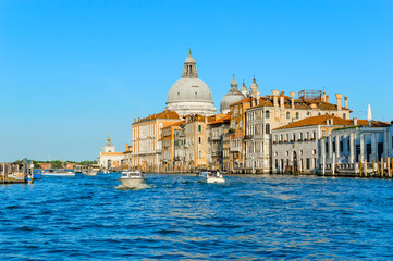 Fototapeta na wymiar Venice, Italy: Basilica Santa Maria della Salute and palaces, view from Grand Canal