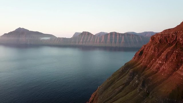 Aerial view of the fjords in Faroe Islands during a spectacular sunset