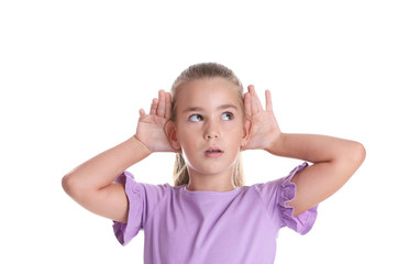 Cute little girl with hearing problem on white background