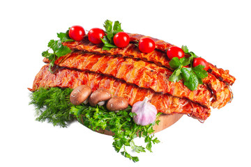 Smoked pork ribs with tomatoes and greens on a white isolated background