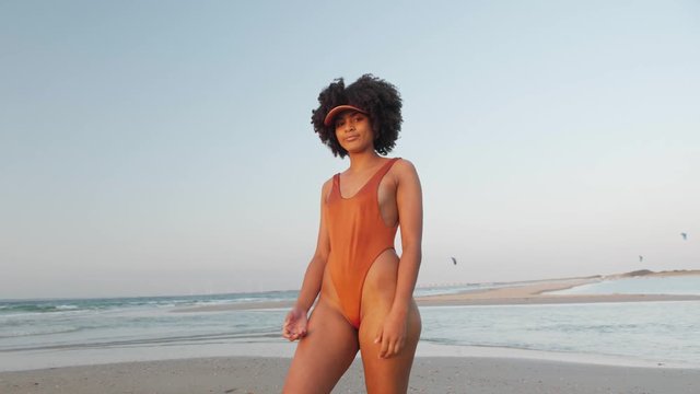 Cute model posing at the beach in a bikini set