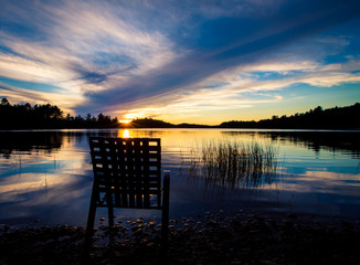 empty chair at lake
