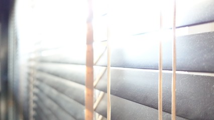 evening sun light outside with wooden made from bamboo window blinds, decoration interior home concept   