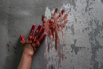 Bloody hand print on wall, crime and horror concept.