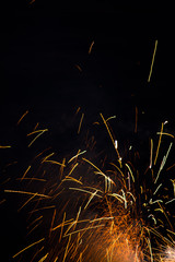 Celebratory fireworks on black background portrait orientation room for text