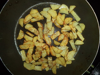 fried potatoes in a frying pan