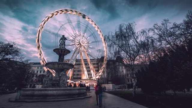 ferris whell timelapse in budapest on erzs  bet square at blue hour