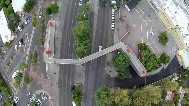 aerial view of People crossing pedestrian bridge.mp4
