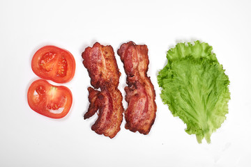 Ingredients for making sandwich. fresh vegetables, tomatoes, bread, becon, cheese. Isolated on white background, top view, copy space