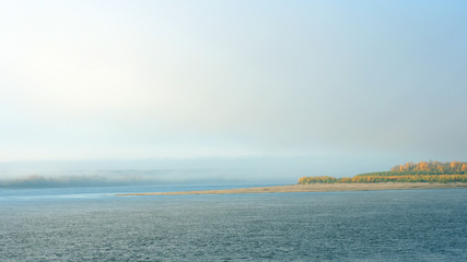 Morning on the river early morning reeds mist fog and water surface on the river