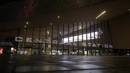 A wide shot at night of the Rotterdam Central Station, of of the biggest tourist icons of the city.