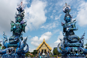 Fototapeta na wymiar Colorful ornamental exterior of Wat Rong Suea Ten (also known as Blue Temple) with beautiful design against blue sky, Chiang Rai