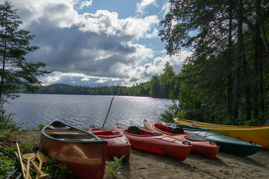 Kayaks and a canoe by the Indian lake in upstate NY (USA)