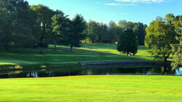 Mowing the green at a golf course